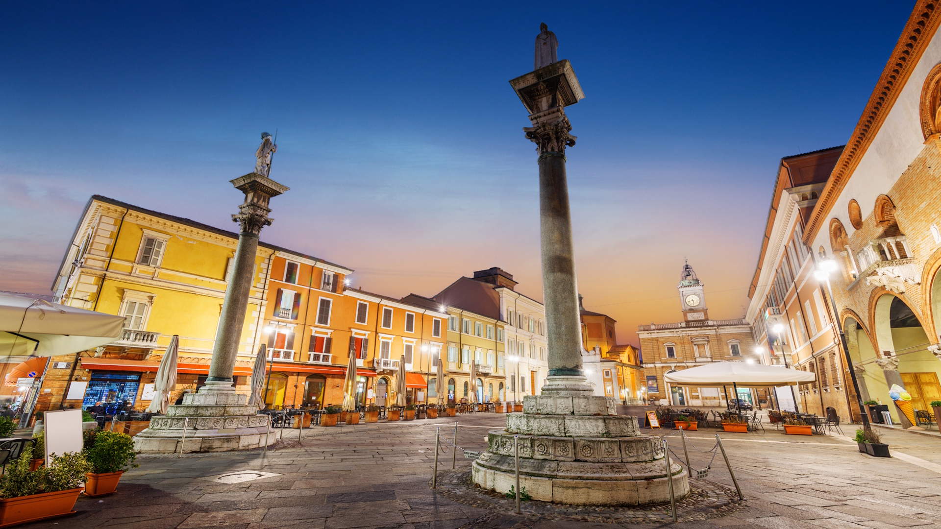 Ravenna, Italy at Piazza del Popolo and landmark towers at dusk.